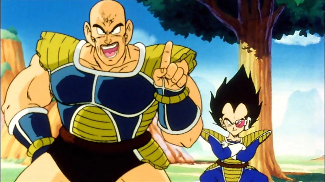 Nappa, a bald giant in blue and yellow armor, shouts with his index finger raised; Vegeta, arms crossed and a pink scouter over his eye, stands back on the right.